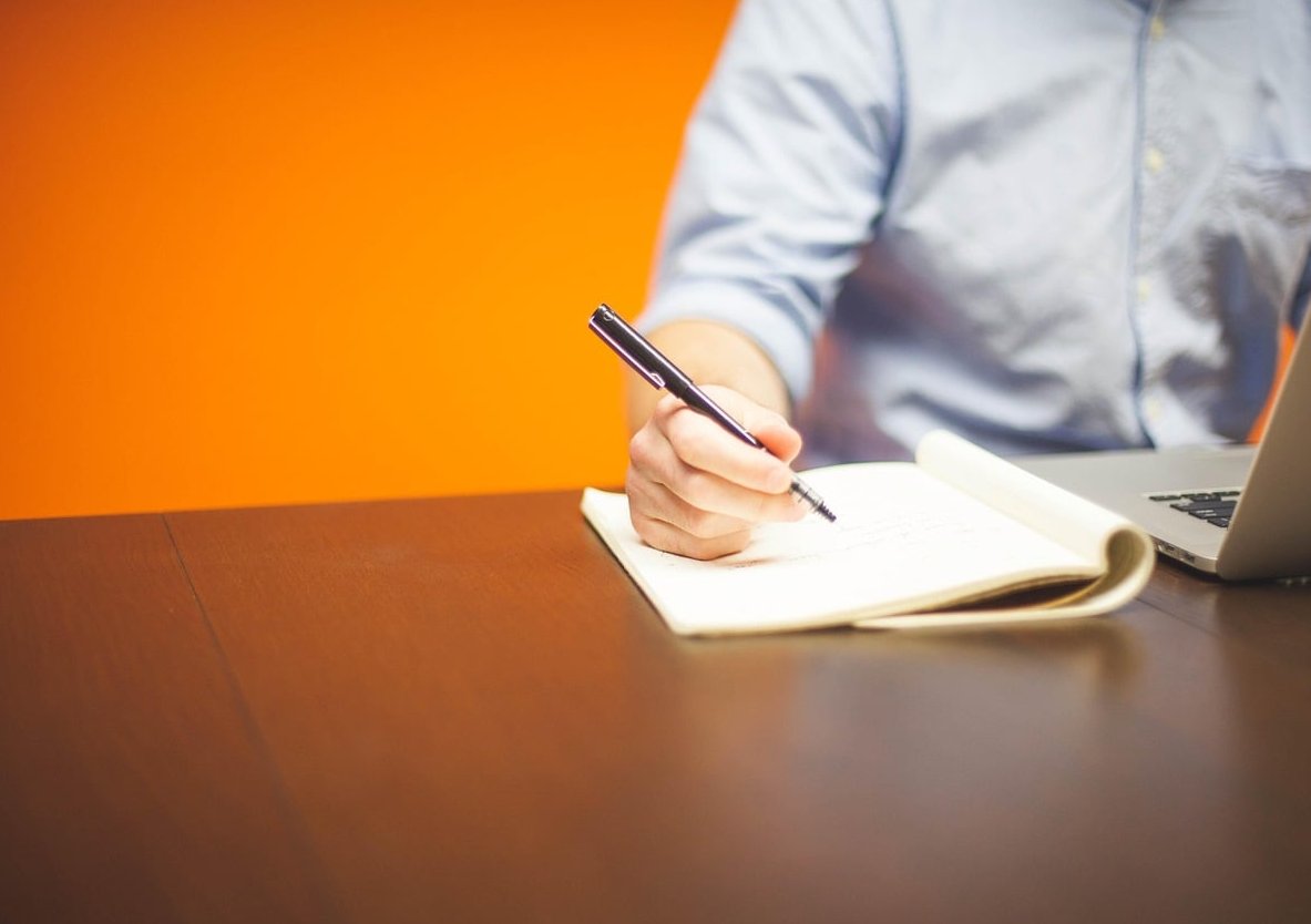 laptop writing notebook